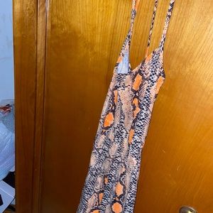 Orange print romper. Back out.